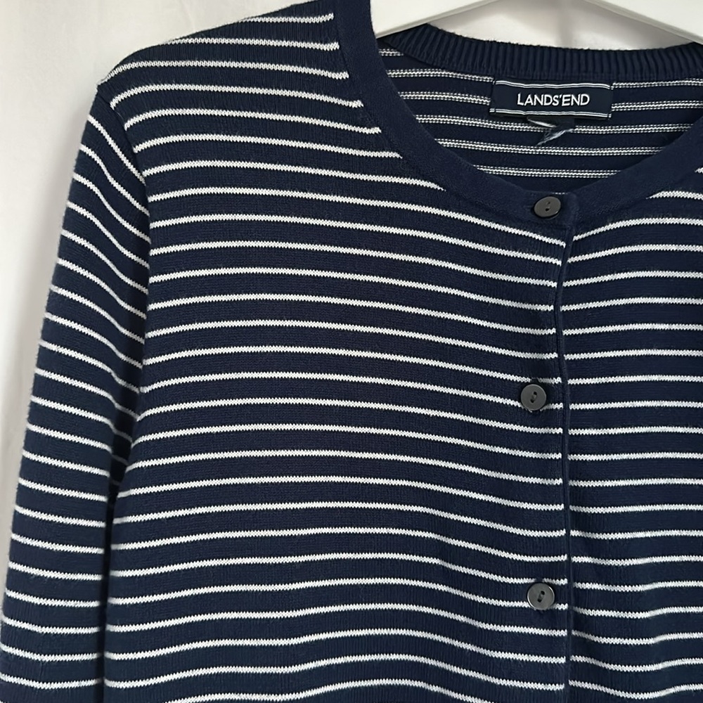 Lands’ End blue and white striped cardigan. pit to pit: 18.5”. length: 25.5”.